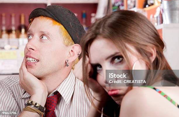 Distracted Young Man And Bored Woman Stock Photo - Download Image Now - Couple - Relationship, Punk - Person, 20-29 Years