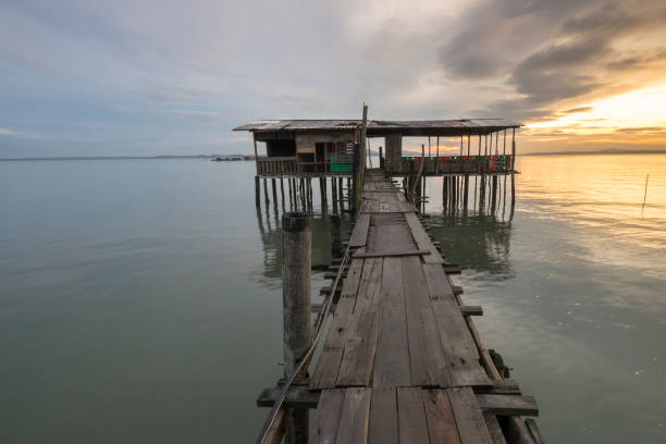 istock Pier Over Sea Against Sky During Sunset 916546752