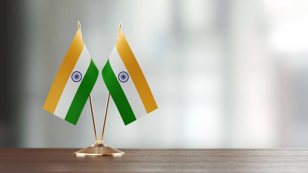 istock Indian Flag Pair On A Desk Over Defocused Background 916557108