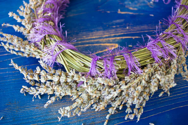 istock Wreath of lavender on blue wooden board 916568136