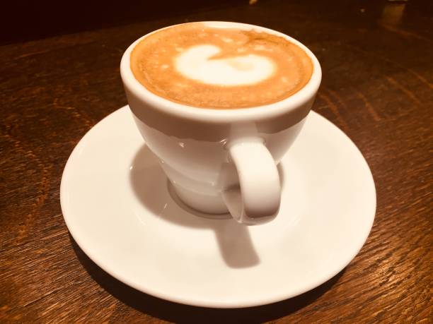 istock Cup Of Cappucino on a wooden table 916571154