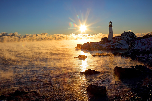 Portland Head Lighthouse is a historic lighthouse in Cape Elizabeth, Maine. The light station is automated, and the tower, beacon, and foghorn are maintained by the United States Coast Guard. The light station sits on a head of land at the entrance of the primary shipping channel into Portland Harbor, which is within Casco Bay in the Gulf of Maine.