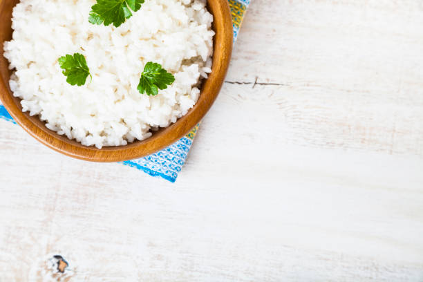 istock Boiled rice in a wooden bowl 916574804