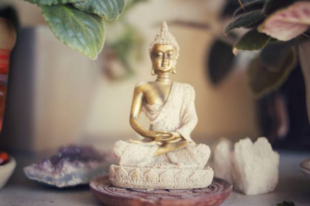 istock Buddha in meditation.Defocus in the background. 916575054