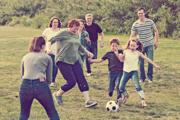 istock people of different ages playing football 916575568