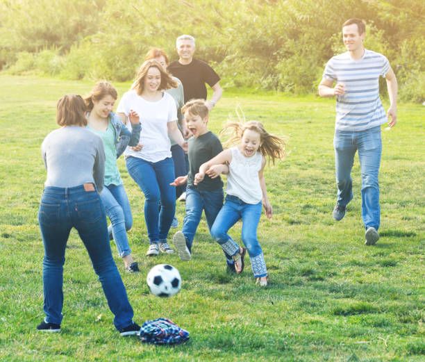 istock people of different ages playing football 916575576