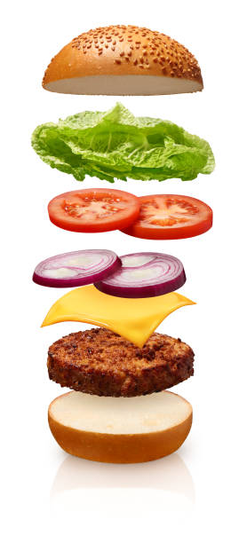 istock Hamburger with cheese, tomato, onions and lettuce on white 916580020