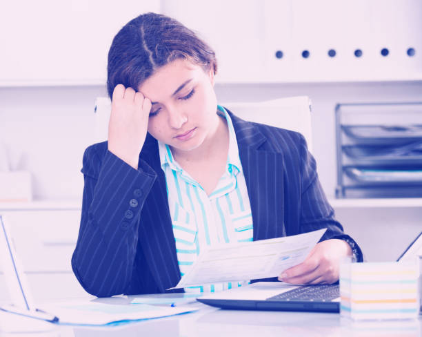 istock Beginner businesswoman is reading documents about the transaction 916586854