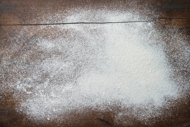 istock Baking background with flour on wooden table 916594366