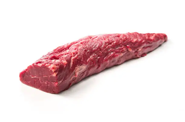 Fresh and raw beef meat. Whole piece of tenderloin ready to cook isolated on white background