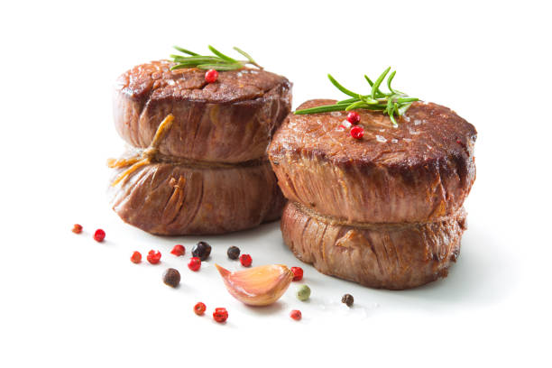 istock Grilled beef fillet steaks mignon isolated on white background 916596500