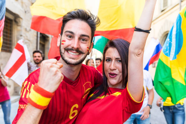 istock Happy couple fans supporters from Spain 916598778