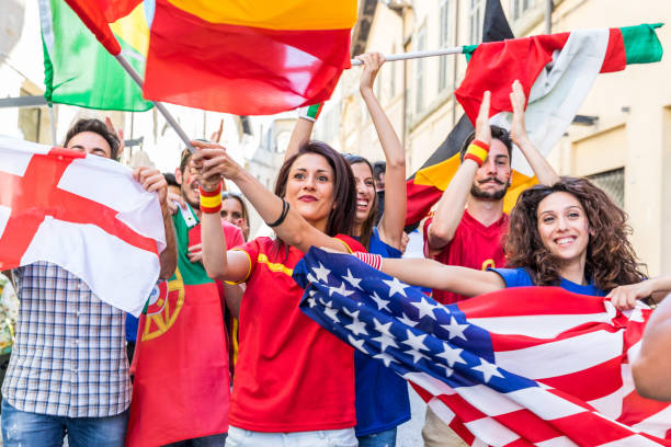 istock Happy fans supporters from different countries 916598824
