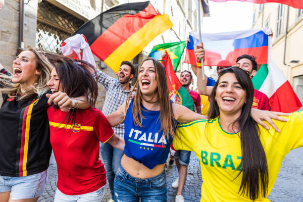 istock Happy fans supporters from different countries 916598888