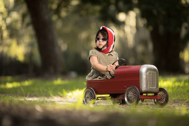 istock Little cuban girl driving car 916599426