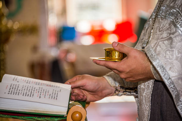 istock the priest and the Bible 916599480