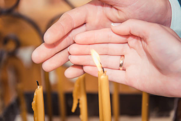 istock wedding candles in the Church , lit the fire 916599650
