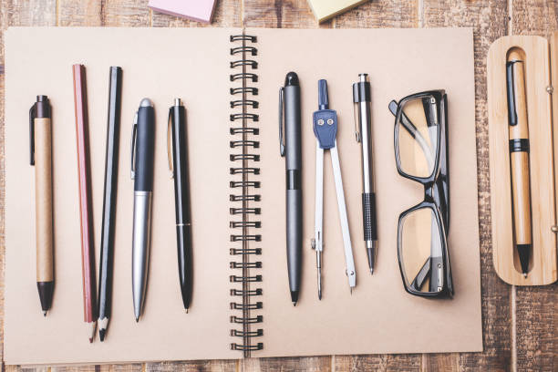 istock Wooden desk with supplies 916602680