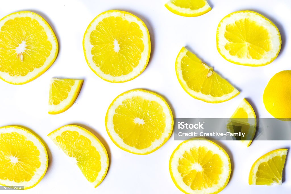 Sliced lemons background pattern isolated Sliced lemons background pattern isolated flay lay Lemon - Fruit Stock Photo