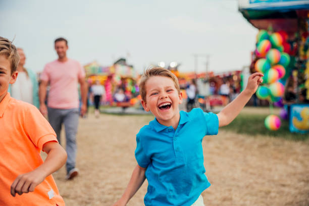 istock Brothers Enjoying the Fairground 916606084