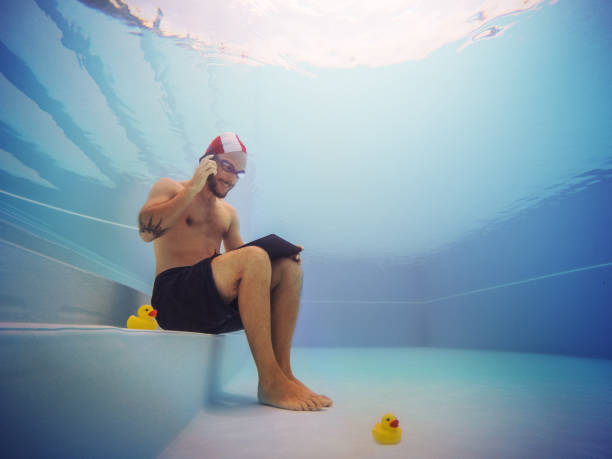 istock Man working at the telephone underwater 916606458