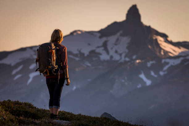 Young woman hiking in Whistler backcountry. stock photo