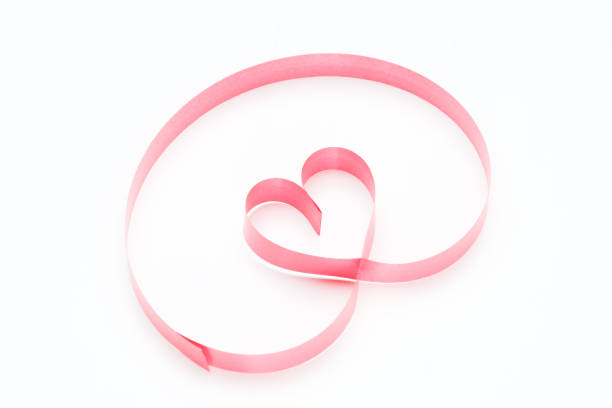istock Ribbons shaped as hearts on white, valentines day concept 916608292