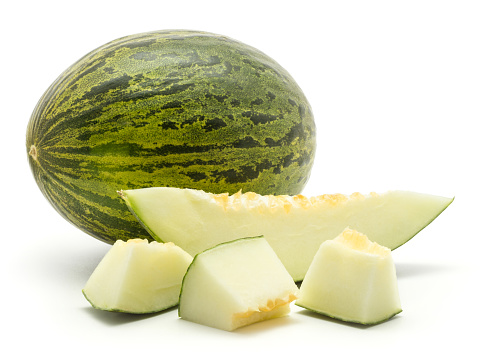 One melon Piel de Sapo with three cut pieces and one slice (Santa Claus Christmas variety) isolated on white background green striped outer rind\