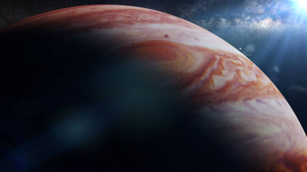 istock planet Jupiter lit by the Sun, in front of the galaxy 916617588