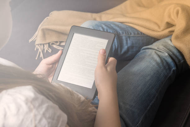 istock Girl is reading ebook on digital tablet device 916625372