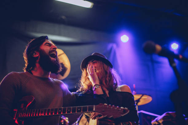 istock Guitarist and his girl 916630218