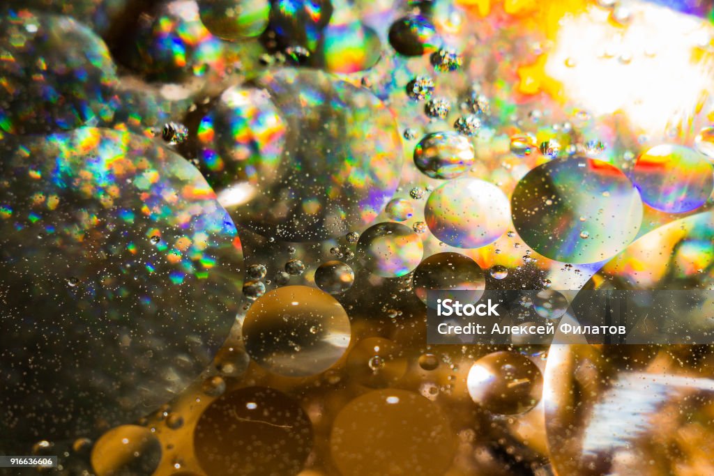 colored water bubbles the colored water bubbles on a yellow background texture abstract holiday Abstract Stock Photo