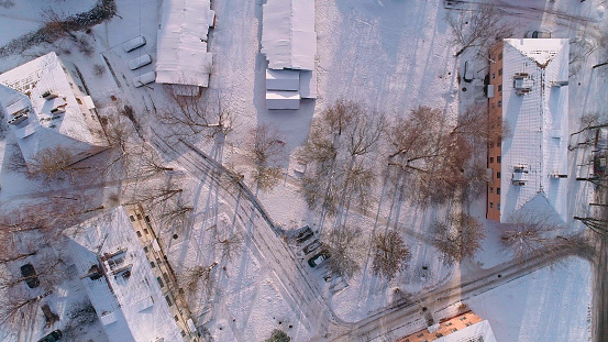 The top view, directly above aerial view on the residential district of the winter city covered by snow. Minsk, Belarus, Eastern Europe.