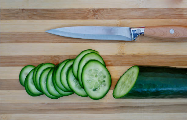 istock Sliced cucumber on a cutting board 916637296