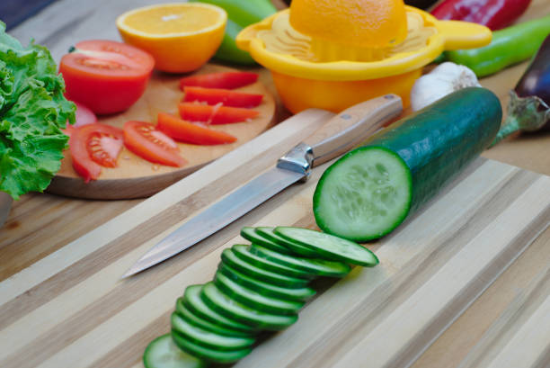 Clean Food , Red bell pepper, Onion , Cucumber , Wood plate , white background