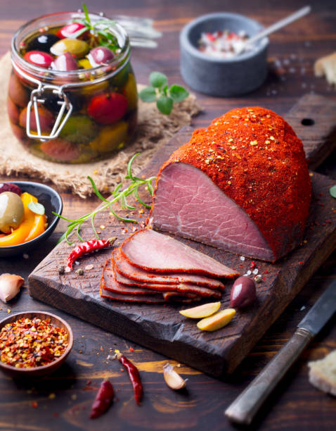 istock Roasted beef, pastrami on slate cutting board. 916642674