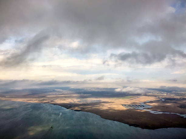 aerial view of New Orleans swamps Flying into New Orleans over swamps and the Mississippi River during a storm. mississippi delta stock pictures, royalty-free photos & images