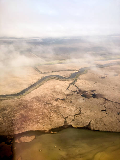 aerial view of New Orleans swamps Flying into New Orleans over swamps and the Mississippi River during a storm. mississippi delta stock pictures, royalty-free photos & images