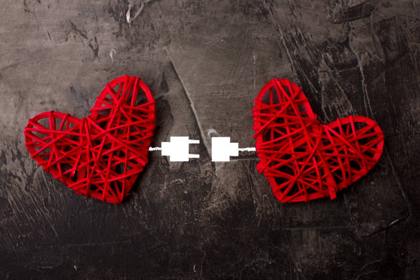 istock Two hearts connected by USB cable. Theme of love, wedding, Valentine's Day 916664782