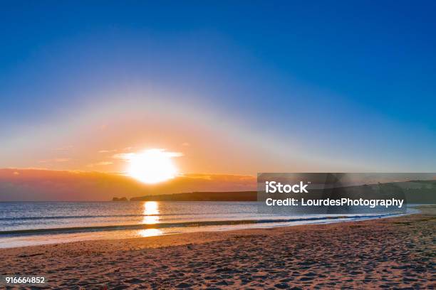Sunrise At Studland Beach Stock Photo - Download Image Now - Bay of Water, Beach, Cliff