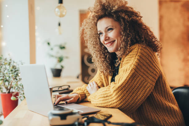 istock Young woman working on a laptop 916683620
