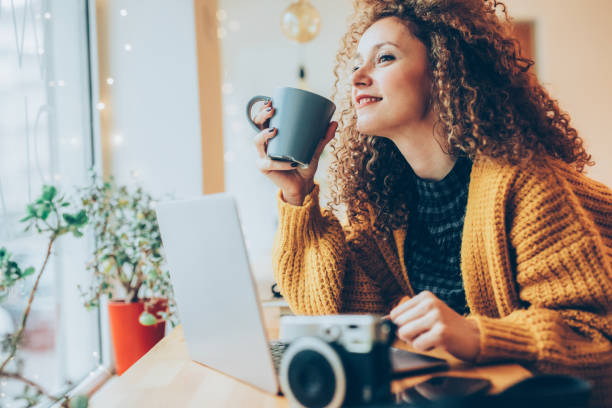 istock Young woman working on a laptop 916683624