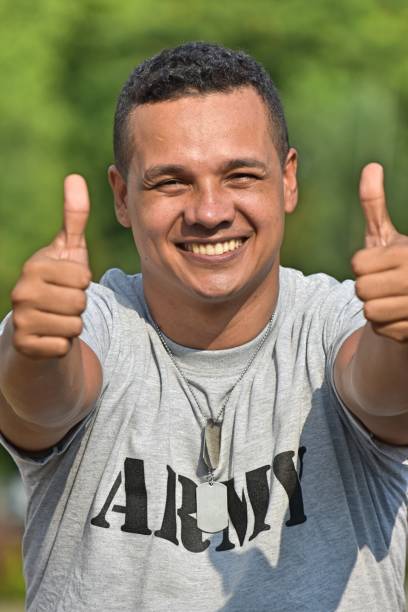 istock Latino Male Soldier With Thumbs Up 916700656