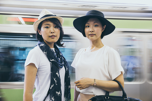 Young friends about to leave for a girl’s day out via the Japanese metro system