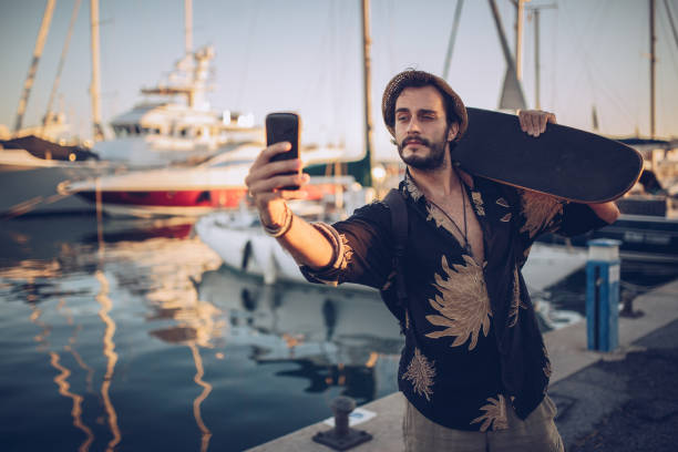 istock Man with skate walking in marina 916704318
