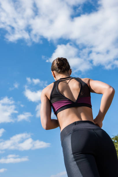 istock woman jogging on nature 916704520
