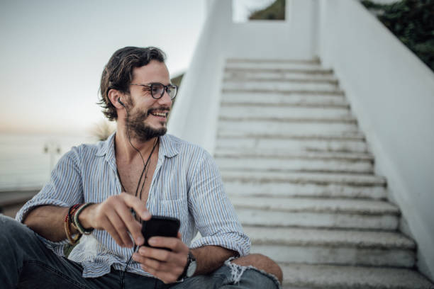 istock Man enjoying music outdoors 916705128
