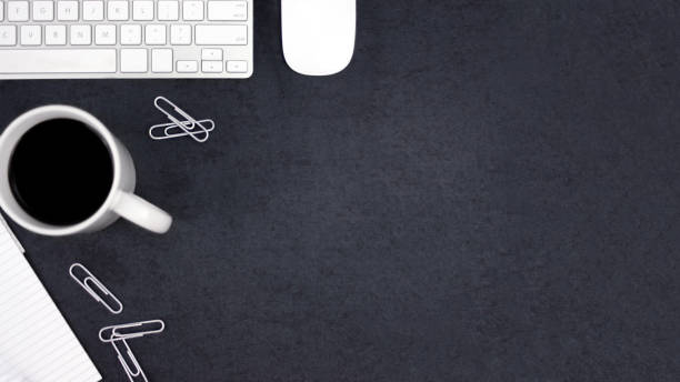 istock Black and White Business Desk with Dark Texture Background 916706062