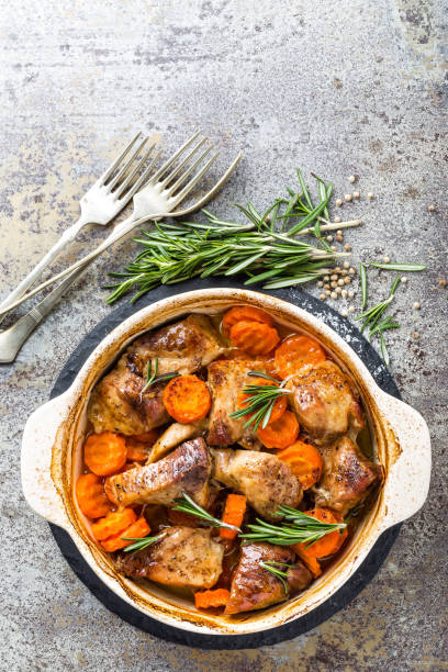 istock Meat baked with carrots in the oven 916714390