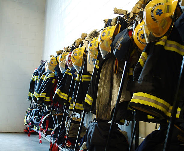 istock Row of firefighter equipment on rack 91671755
